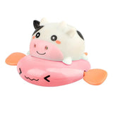 Cute cartoon cow toy with a pink floaty on a white background