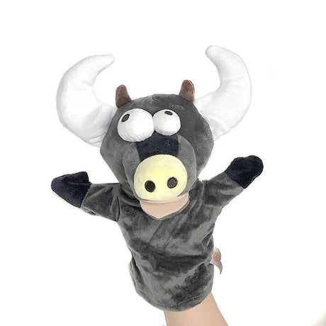 Plush bull puppet with a hand holding it against a white background