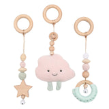 Baby teething toy with cloud-shaped soft toy and wooden rings on a white background