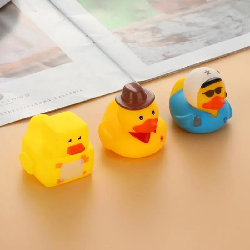 Three rubber ducks with different hats.