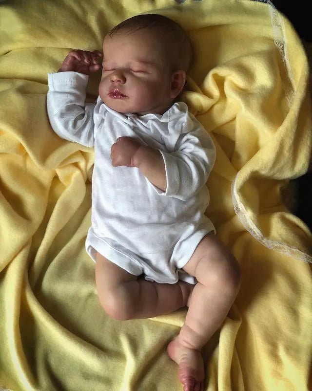 50cm LouLou Reborn Doll with hand-painted silicone face and soft cloth body for newborn photography props and doll display.