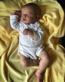 50cm LouLou Reborn Doll with hand-painted silicone face and soft cloth body for newborn photography props and doll display.