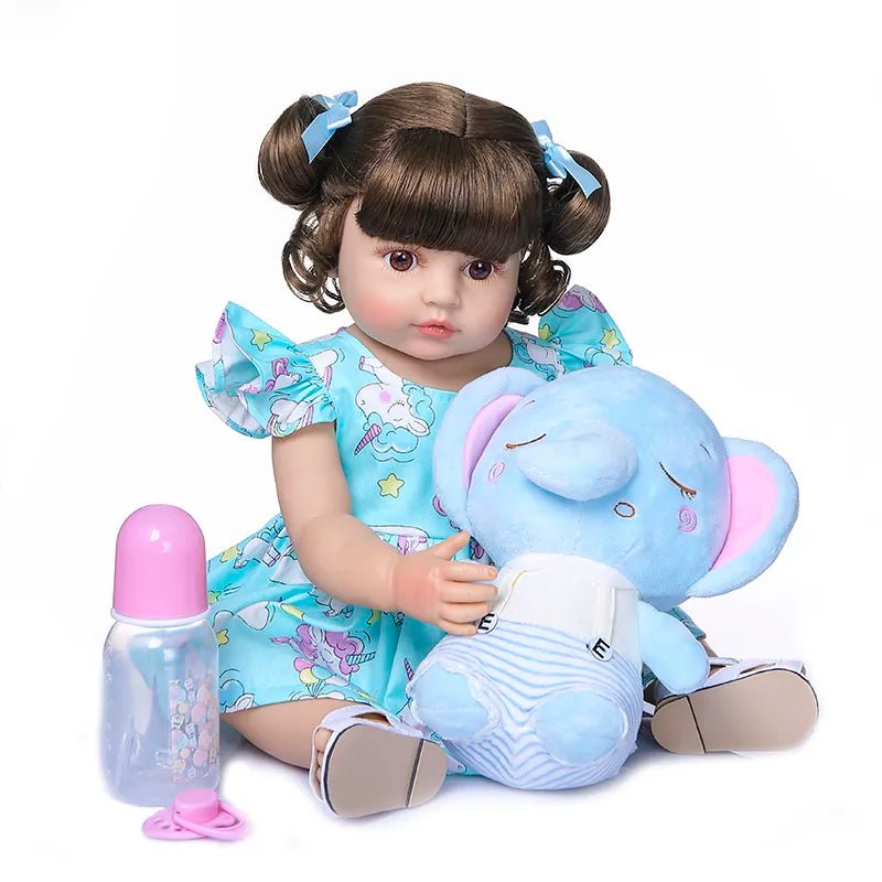 50CM Soft Silicone Reborn Toddler Doll with brown pigtails and elephant plush on a plain backdrop for collectors and gift buyers.