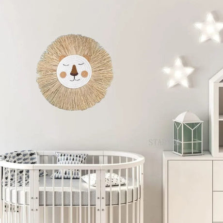 Nursery room with a round crib, lion head wall decoration, and star lights.