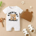 Baby outfit set with white onesie, brown hat, and sandals on a beige background