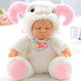 Baby doll in an elephant costume with pink ears and feet, sitting on a white surface.