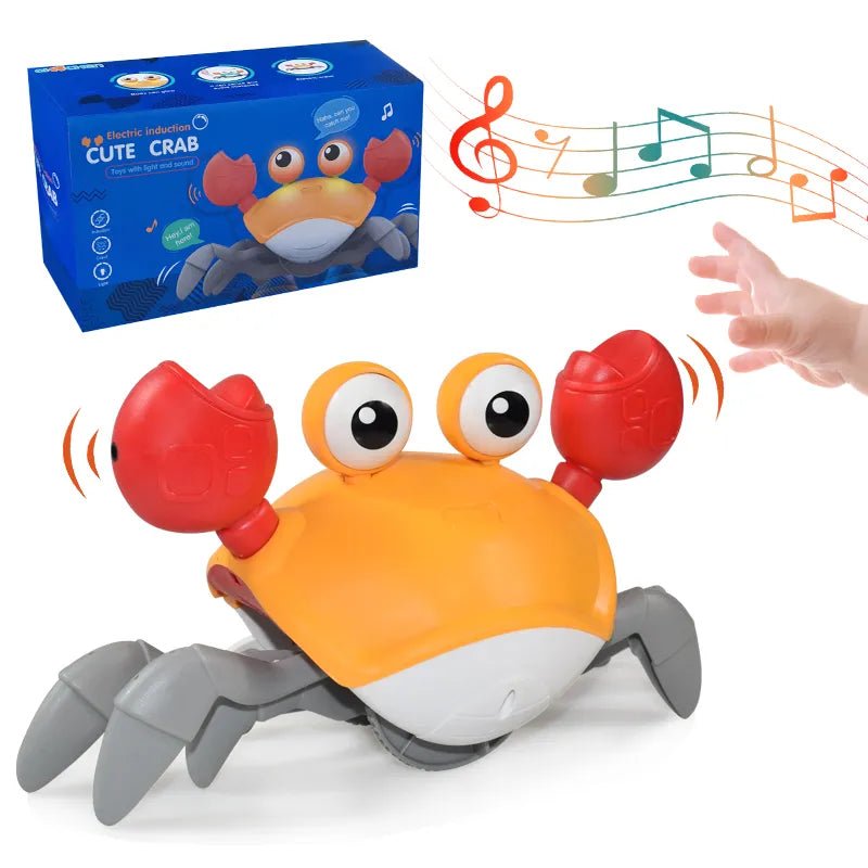 Toy crab with music notes, next to its packaging and a hand reaching towards it.