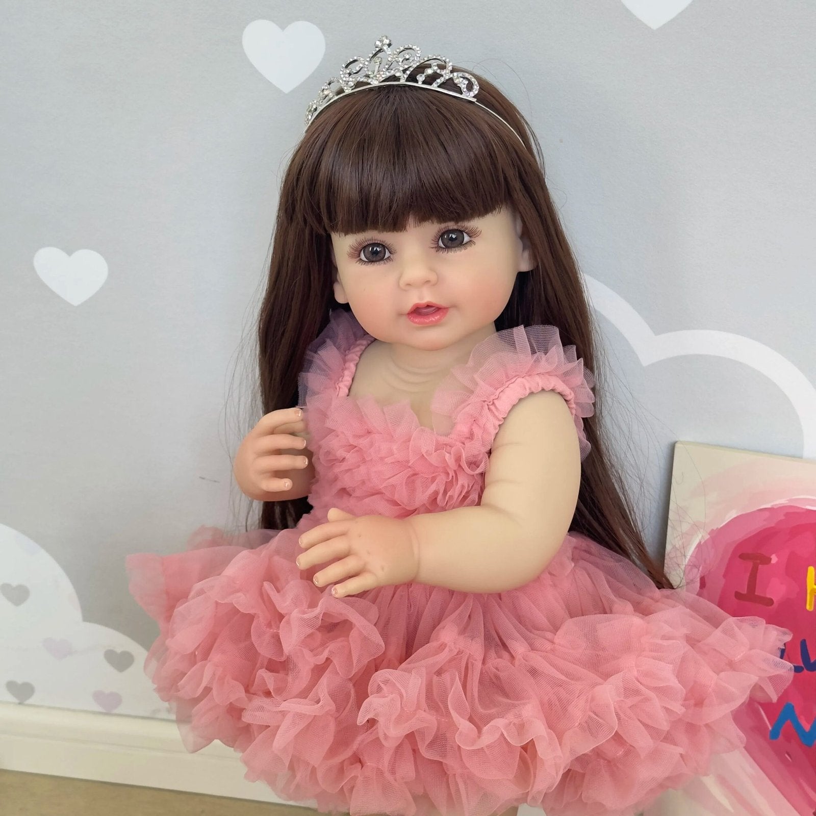55CM Full Body Reborn Toddler Doll in a pink princess dress and tiara, a soft silicone doll for collecting, display, and gifting.