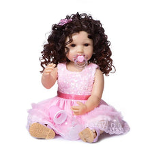 Full silicone Reborn Toddler Doll in a pink dress holding a pacifier for nurturing pretend play and realistic baby care role play.