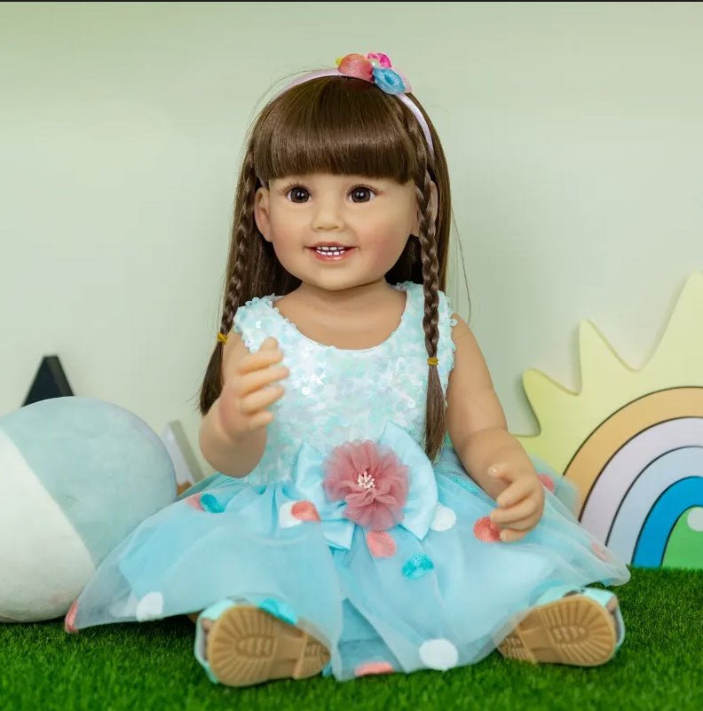 55CM Reborn Toddler Fashion Doll in a light blue floral skirt, a soft silicone lifelike doll for outdoor photo play and collecting.