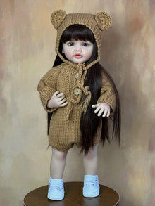 Standing Reborn Doll in a brown knit bear-ear outfit, a sweet silicone baby doll for cosy cuddles and birthday gifting.