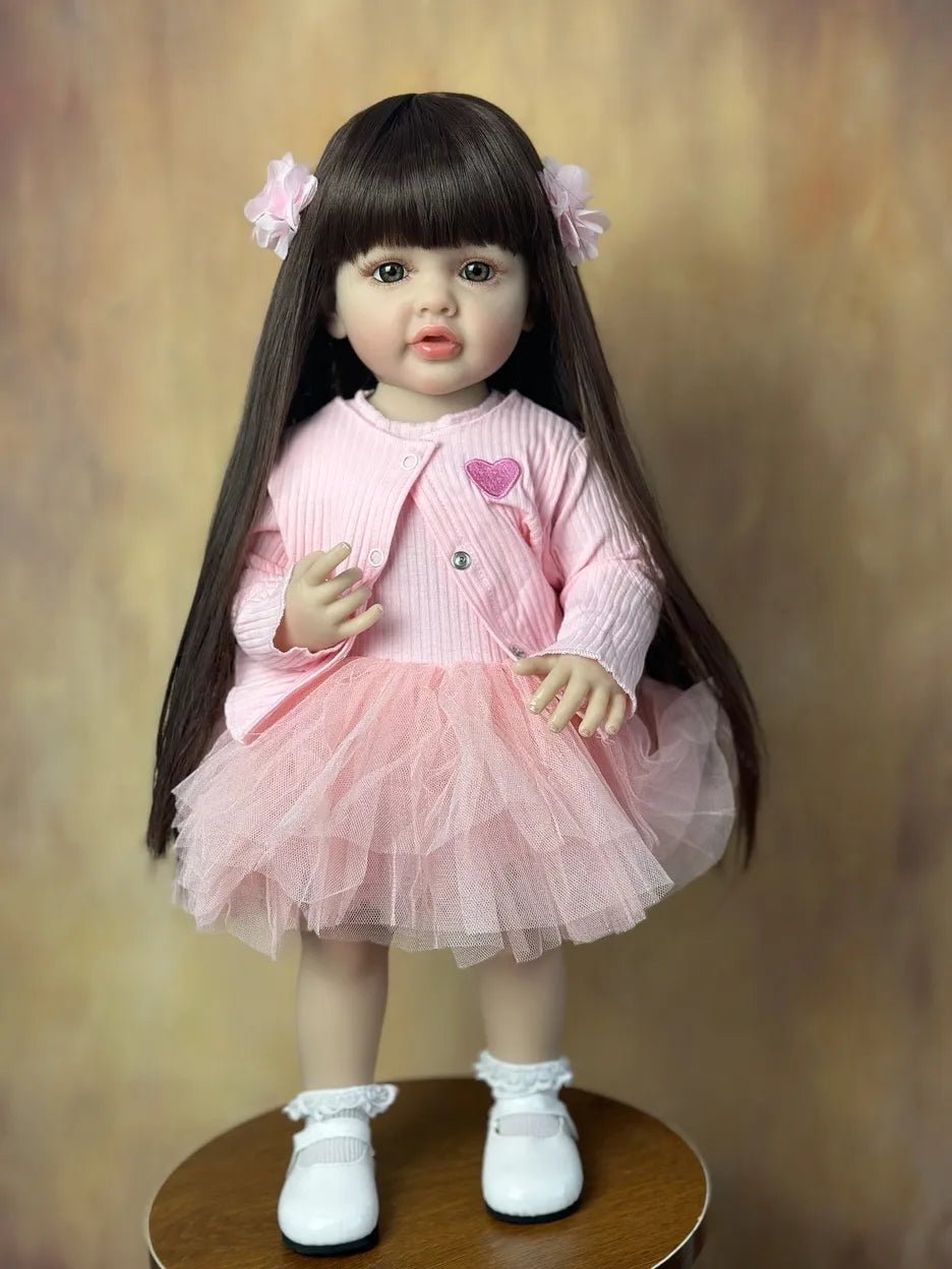 55CM Standing Reborn Doll in a pink heart outfit, a soft silicone baby doll for pretend play, collecting, and birthday gifting.