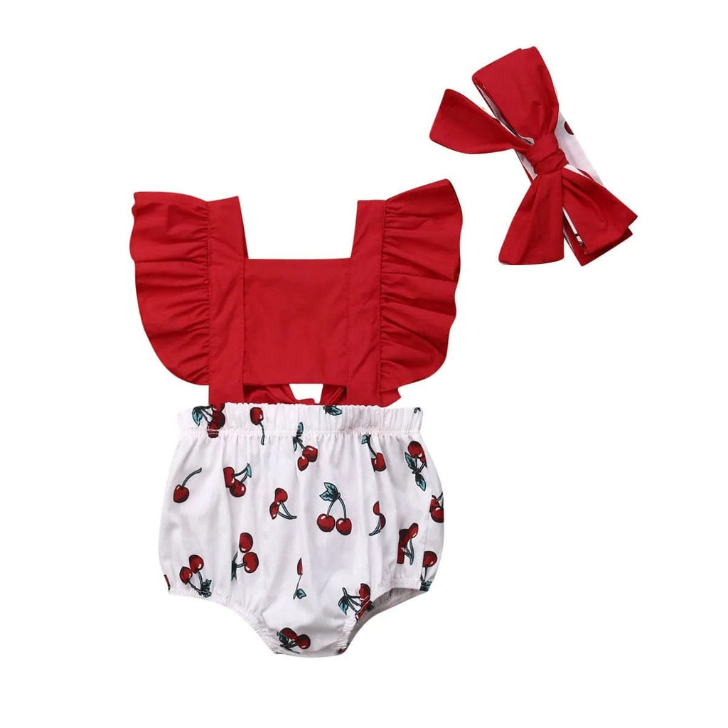 Red top and white bloomers with cherry pattern, accompanied by a red headband on a white background.