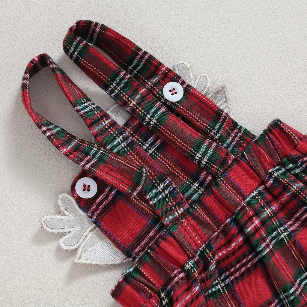 Red and green plaid dress with white buttons on a light gray background