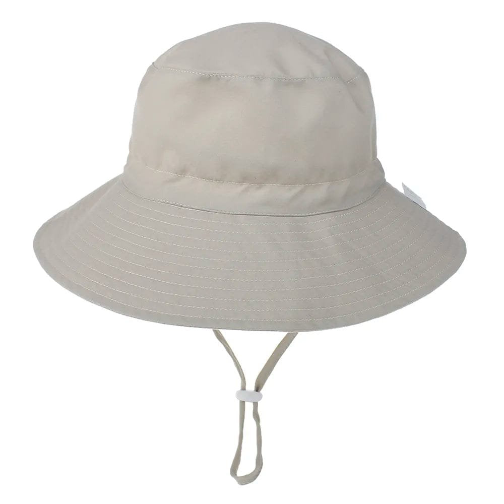 Beige bucket hat with a strap on a white background