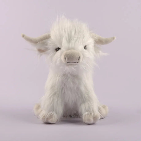 Plush toy of a white fluffy creature on a light purple background