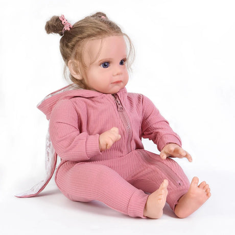 A doll wearing a pink outfit.