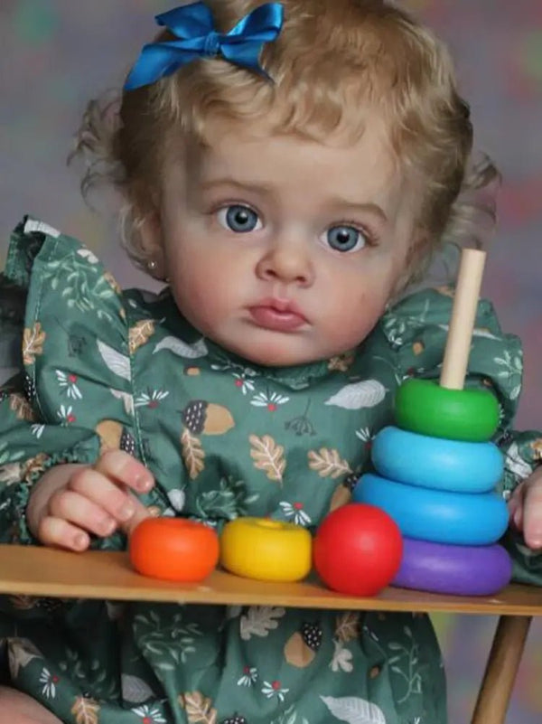 58cm Lifelike Toddler Reborn Doll Tutti posed with a colourful abacus and wooden toys for playroom display and imaginative play.