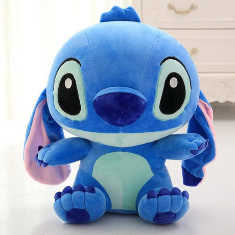Blue plush toy with large eyes on a light background