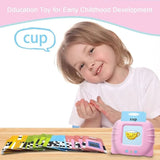 Child with educational toy and flashcards on a table, promoting early childhood development.