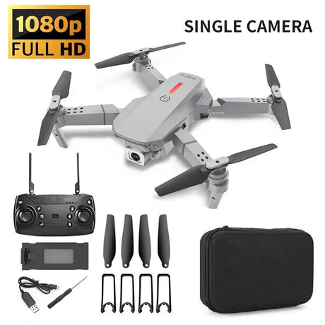 Drone with remote control, battery, propellers, and carrying case on a white background