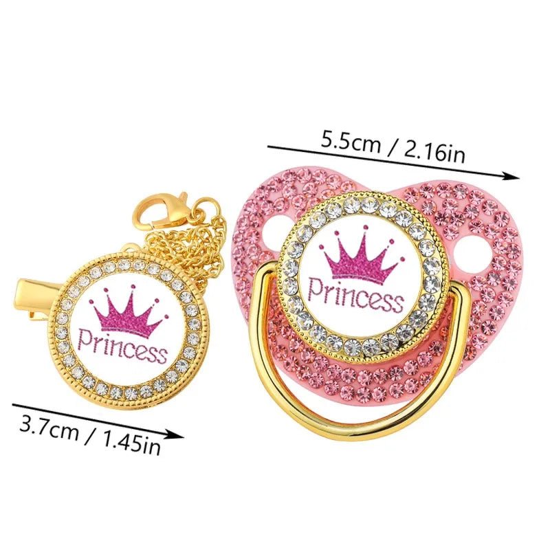 Pink and gold pacifier with 'Princess' text and crown design, measurements indicated.