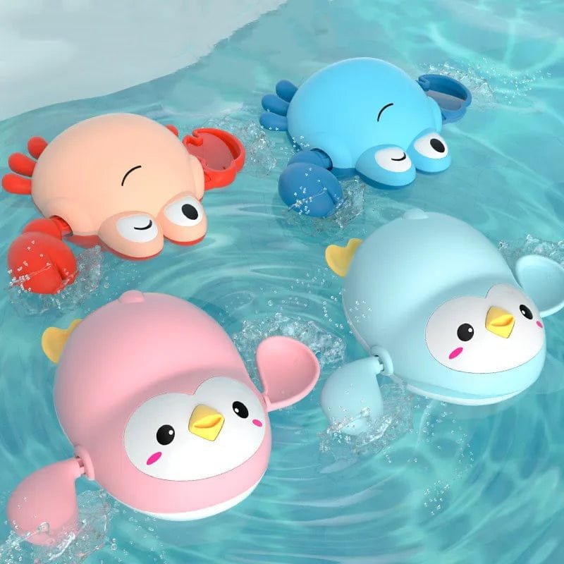 Three colorful bath toys, including a pink penguin, blue octopus, and orange crab, floating in water.