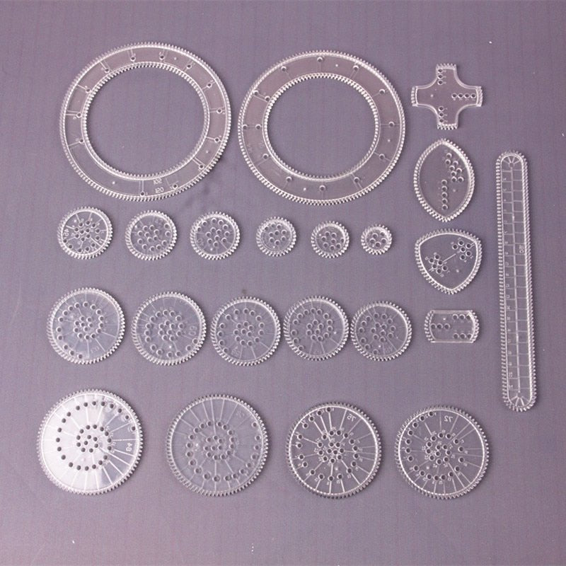 Set of mechanical gear components on a gray background