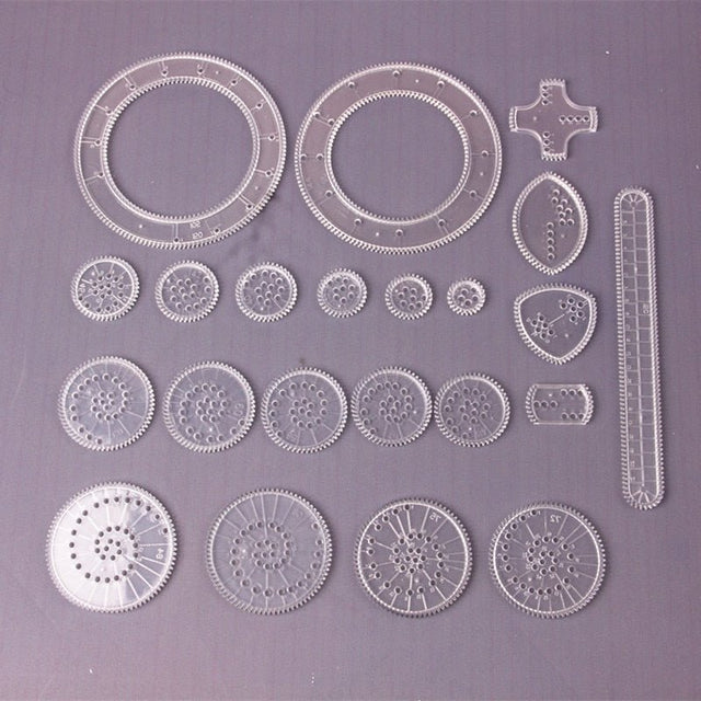Set of mechanical gear components on a gray background