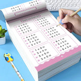 Educational math workbook with a hand holding a pencil on a blue surface