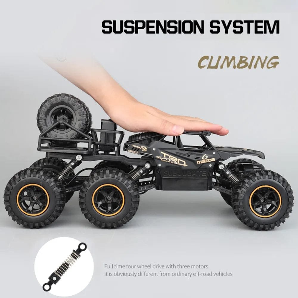 6WD RC truck suspension detail for climbing rough terrain during outdoor play and obstacle racing.