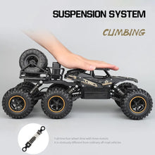 6WD RC truck suspension detail for climbing rough terrain during outdoor play and obstacle racing.
