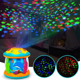 Colorful toy projector with star and fish patterns on a dark background