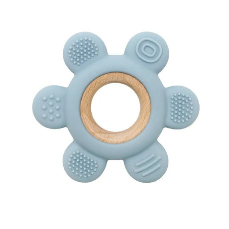 Blue teething ring with wooden center on a white background