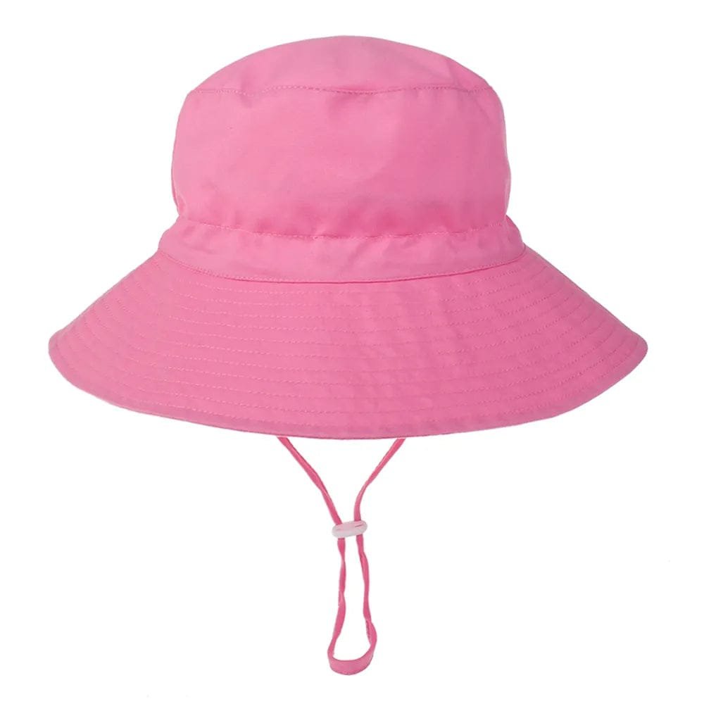 Pink bucket hat with a strap on a white background