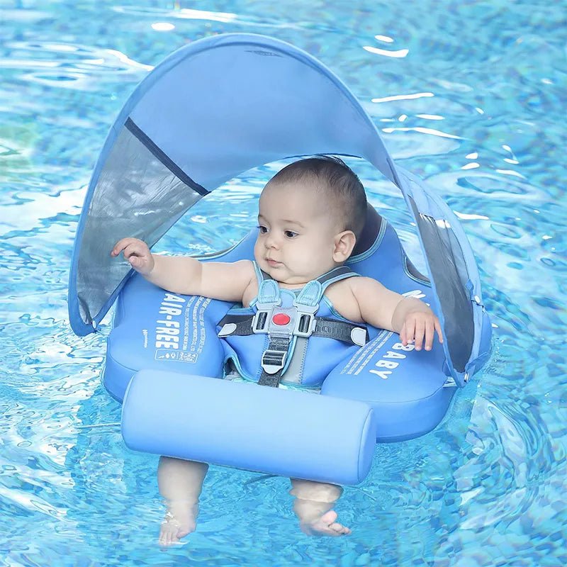 Baby in a blue inflatable swimming seat with canopy in a pool