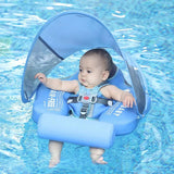 Baby in a blue inflatable swimming seat with canopy in a pool