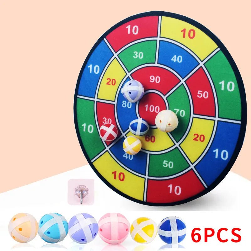 Colorful dartboard game with darts on a beige background