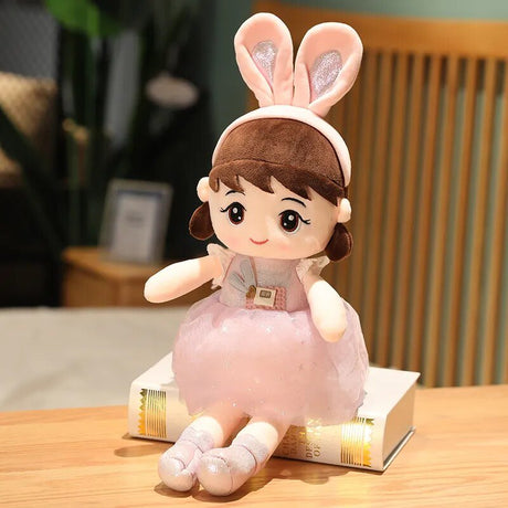 Plush toy with rabbit ears on a wooden table