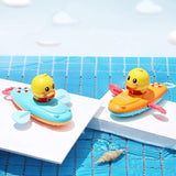 Two colorful rubber duck toys on small boats in a pool.