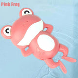 Pink frog-shaped toy on a light blue background