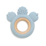 Blue teething ring with wooden center on a white background