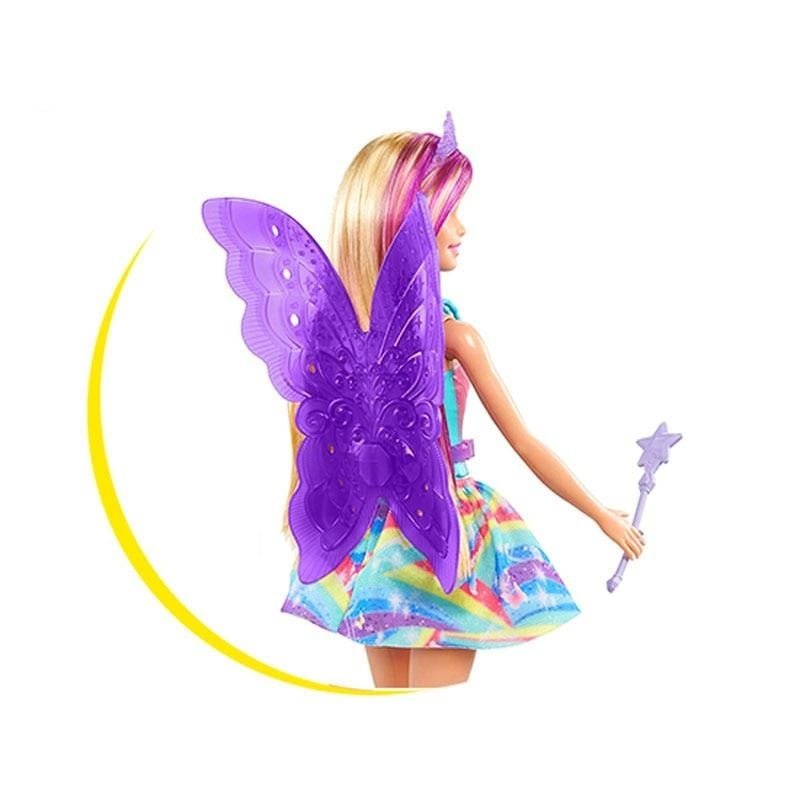 Toy doll with purple butterfly wings and a colorful dress on a white background