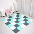 Checkered foam mat on a floor with white furniture and curtains in the background