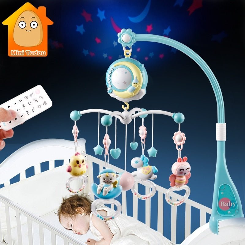 Baby crib mobile with toys and a remote control, featuring the Mini Tudou brand.