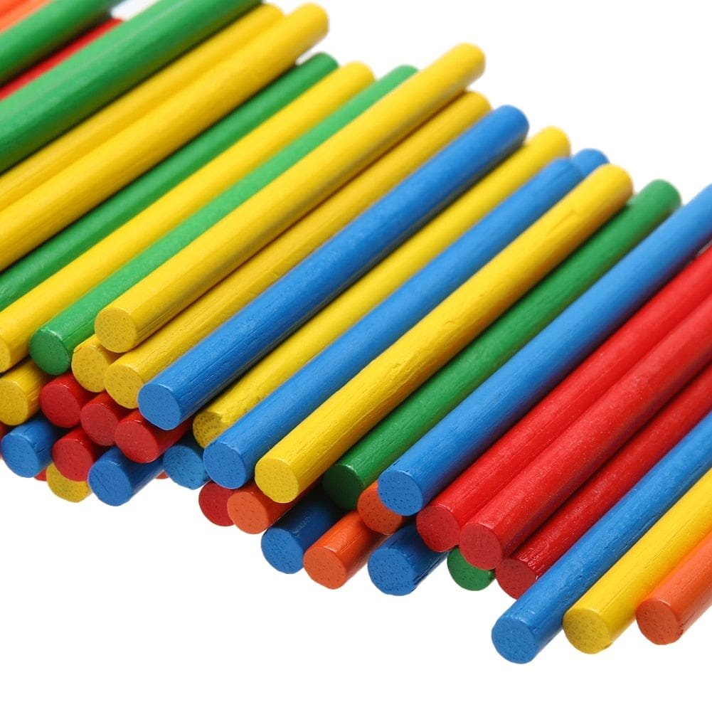Colorful wooden sticks in red, blue, green, and yellow on a white background