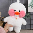White plush duck toy with pink cheeks and orange beak held by a hand against a gray tiled wall.