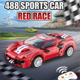 Red sports car toy with remote control on a racing track background