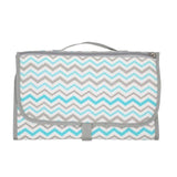 Chevron-patterned bag with gray and blue zigzag design 