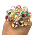 Colorful button bracelet on a hand.